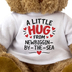 Close-up of the two-line A Little Hug From Newbiggin-by-the-Sea T-shirt design