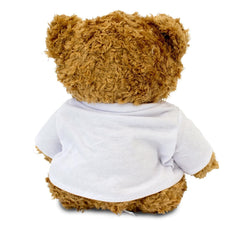 Back view of the brown teddy bear wearing a plain white T-shirt