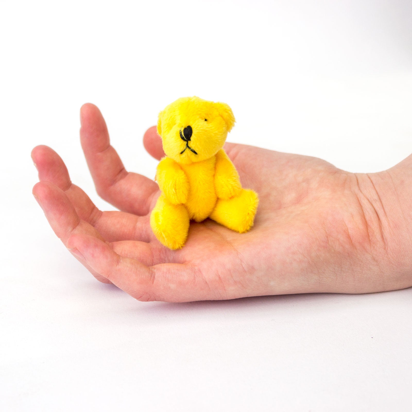 Small yellow shop teddy bear